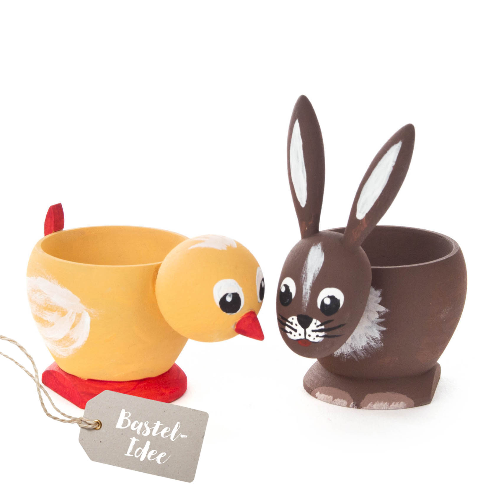 Two painted Easter egg holders, one shaped like a yellow chick with a red base and the other like a brown rabbit with large ears and white accents. im Dregeno Online Shop günstig kaufen