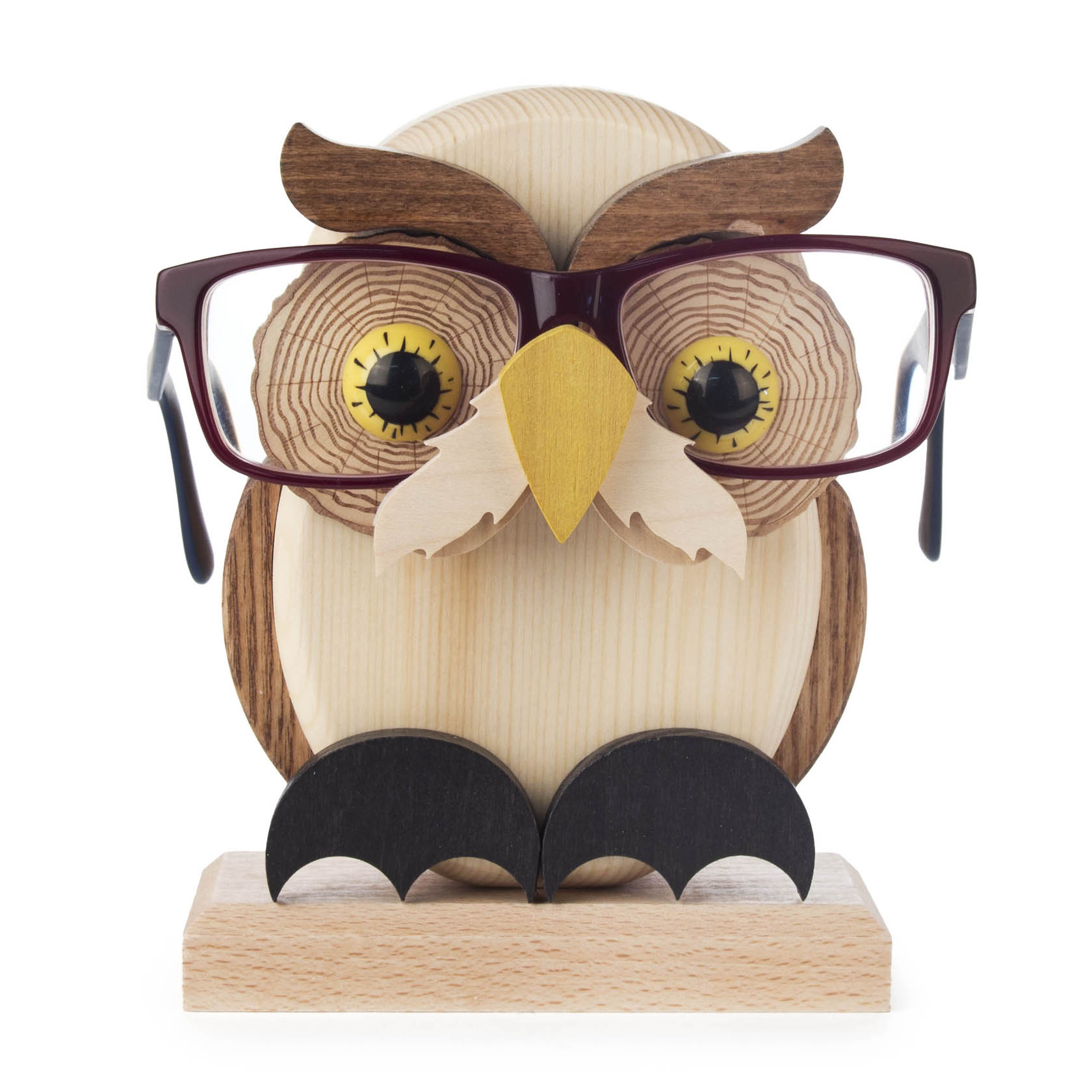 Wooden owl figurine designed as a glasses holder, with detailed carvings for eyes and a beak, supporting brown-framed glasses.