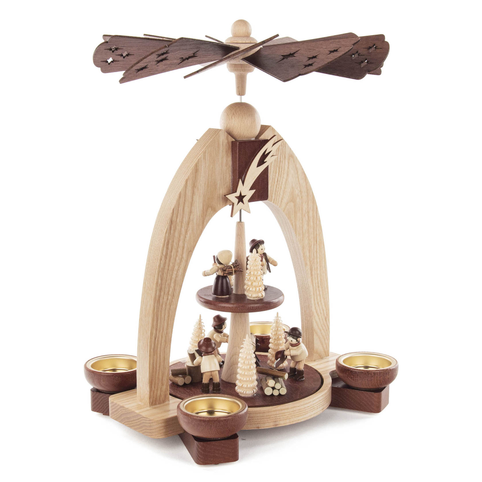 A two-tiered wooden pyramid with a forest theme, designed to hold tea lights. Features carved figures and trees, with a spinning propeller on top.