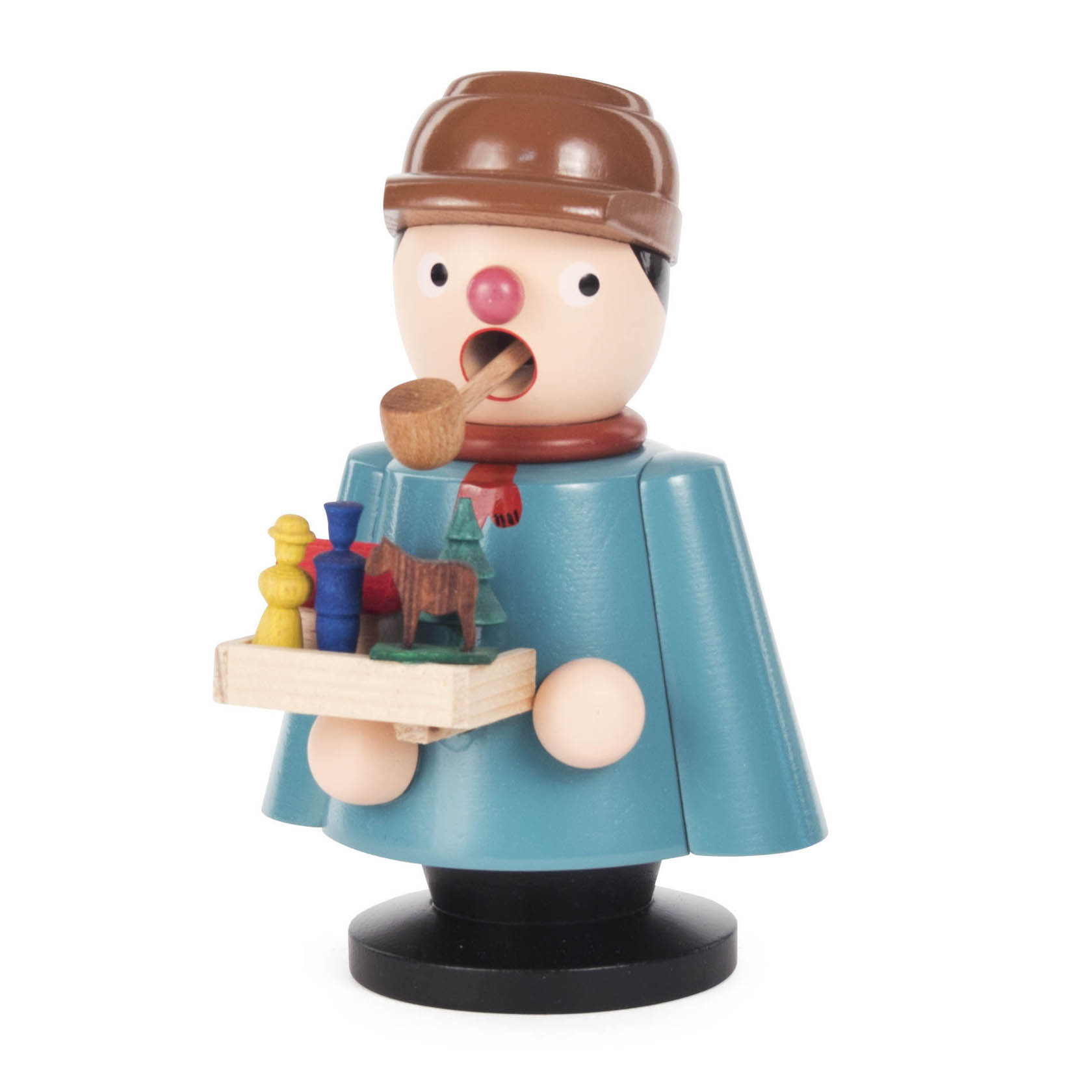 Räuchermann in Form eines Spielzeughändlers mit Pfeife, blauer Jacke und braunem Hut, hält eine Holzplatte mit buntem Spielzeug. im Dregeno Online Shop günstig kaufen