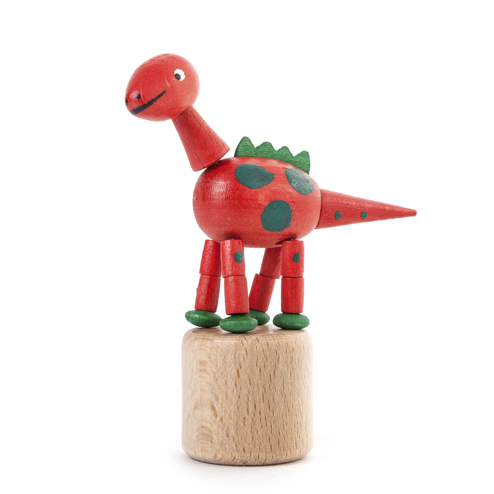 Roter Wackeldinosaurier mit grünen Punkten, grünen Füßen und einem freundlichen Gesicht, der auf einem Holzsockel steht. im Dregeno Online Shop günstig kaufen