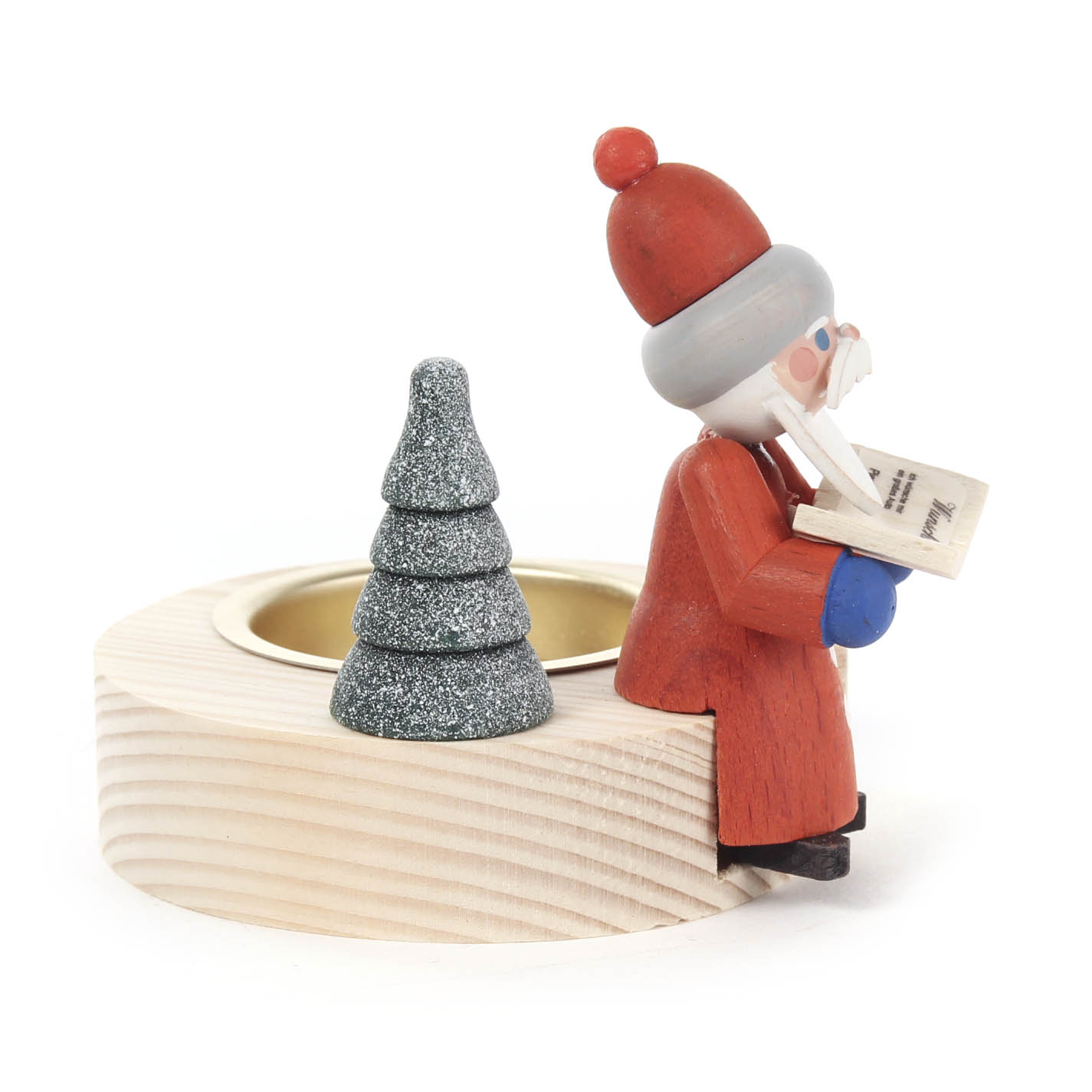Holz-Teelichthalter mit einer Figur eines Weihnachtsmannes, der auf einem Baumstammhocker sitzt und ein Buch liest, sowie einem grauen, funkelnden Miniaturbaum.
