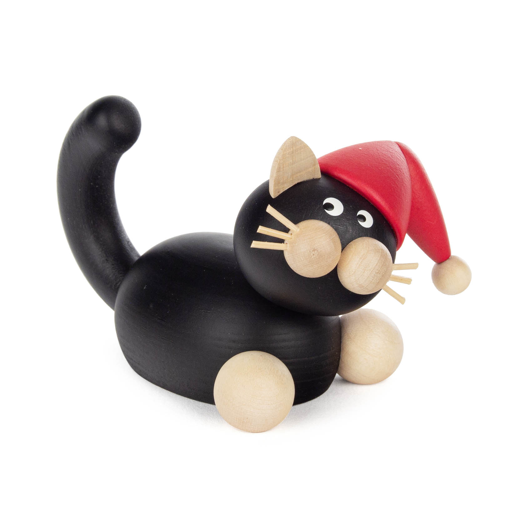 Holzfigur einer schwarz-weißen Katze mit einer roten Weihnachtsmütze, die aufmerksam guckt. im Dregeno Online Shop günstig kaufen