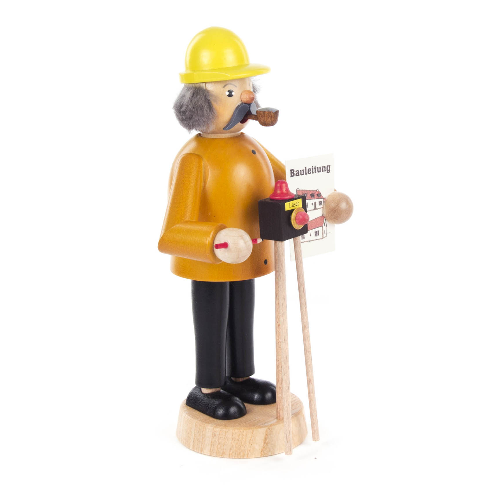 Holzfigur eines Bauleiters mit gelbem Helm, Pfeife, Bauplänen und Baukastengestell. Die Figur trägt einen braunen Mantel und schwarze Hosen.