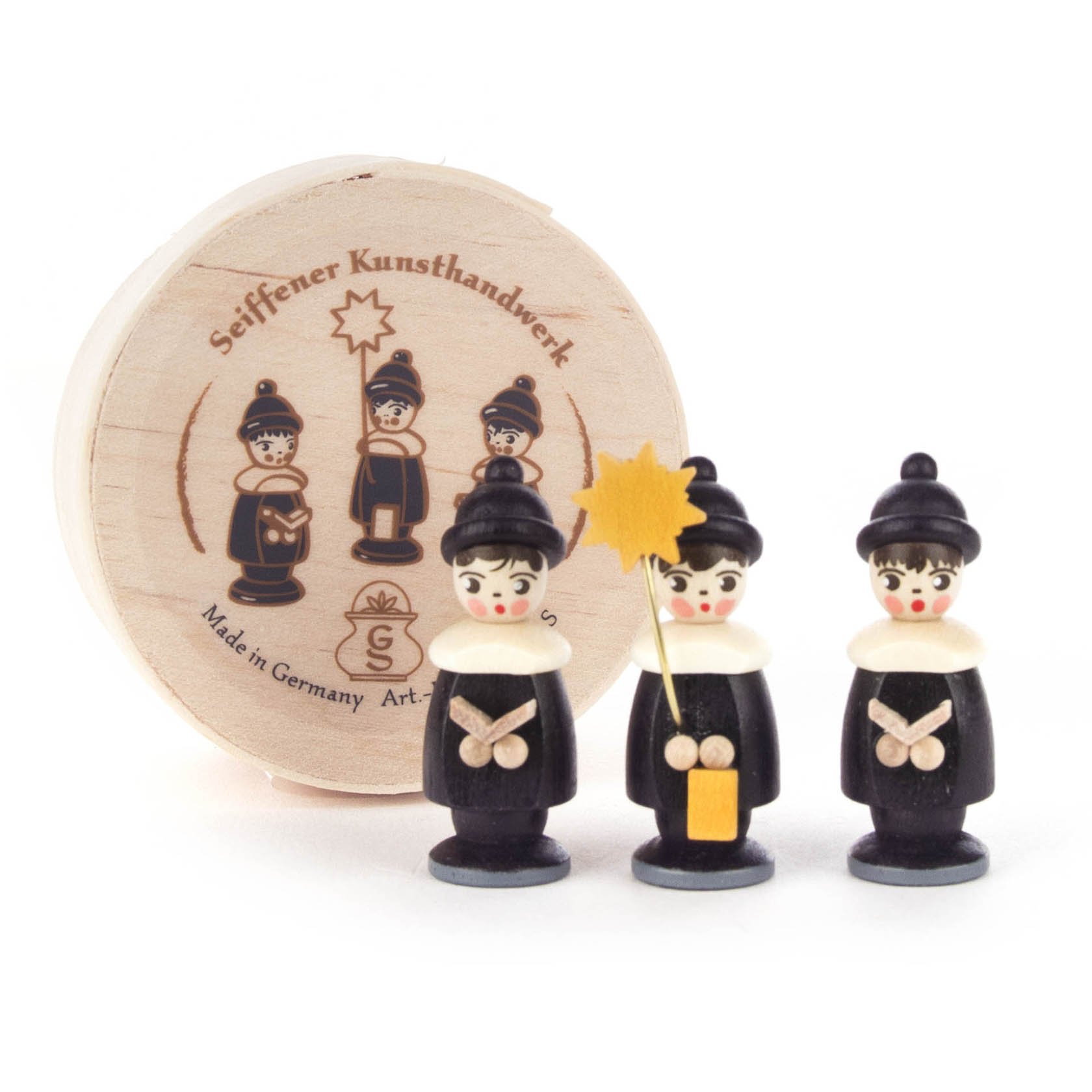 Drei schwarze Kurrendefiguren mit weißen Kragen, eine mit Stern und eine mit Laterne, stehen vor einer runden Spandose. im Dregeno Online Shop günstig kaufen