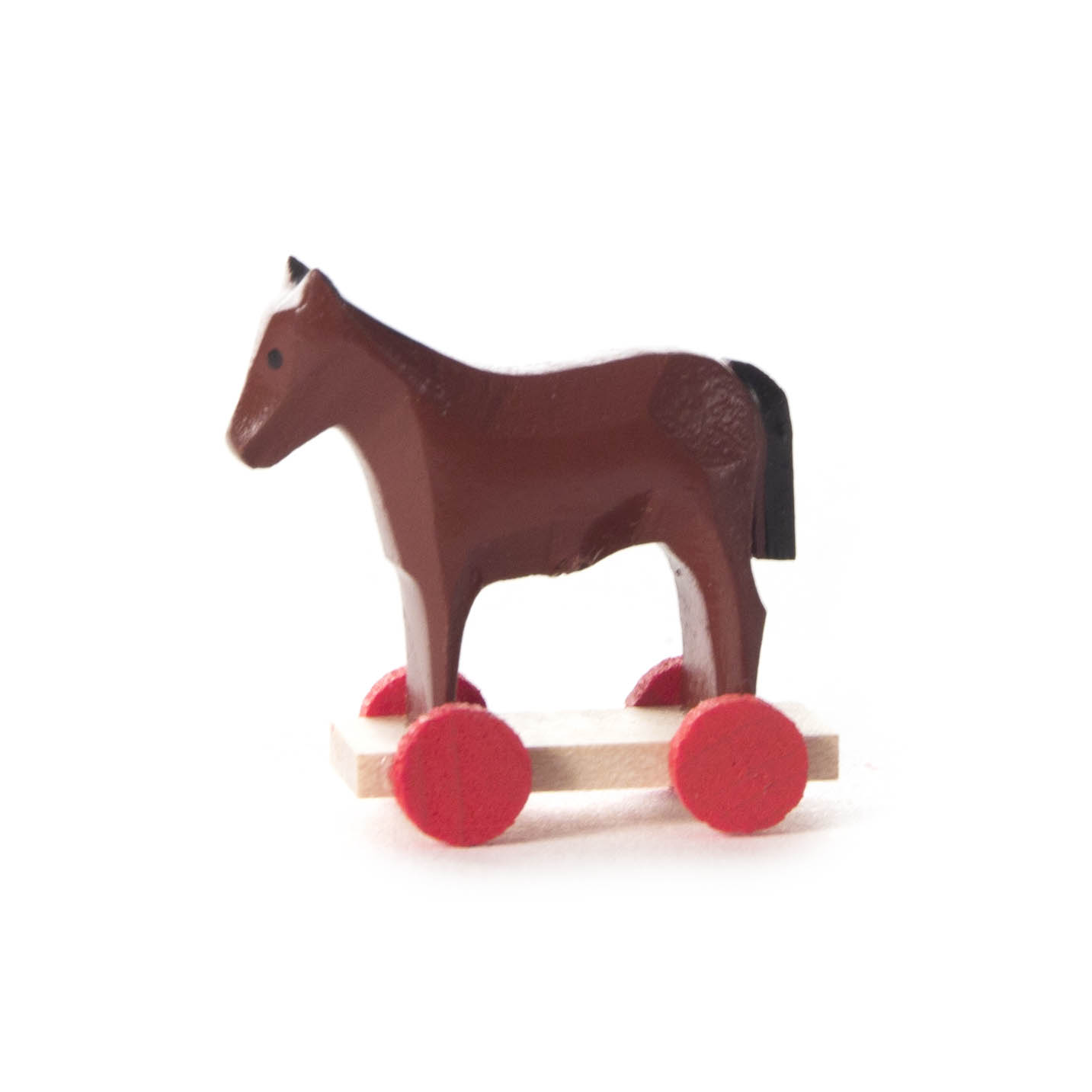 Mini-Holzpferd auf rotem Rädergestell, dient als einfaches Spielzeug zum Hinterherziehen. im Dregeno Online Shop günstig kaufen