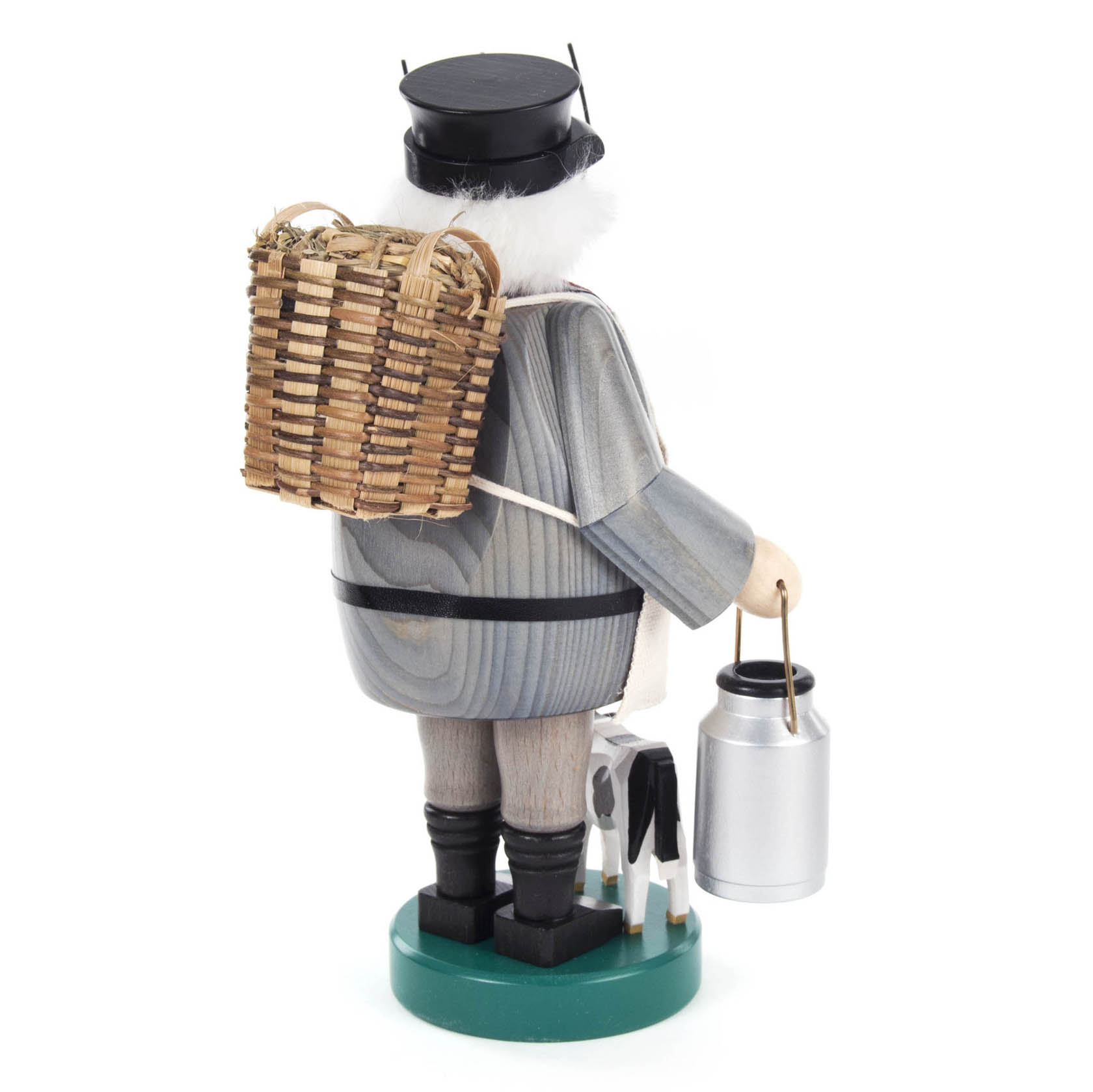 Ein hölzerner Räuchermann in Form eines Bauern mit schwarzem Hut, einem Korb auf dem Rücken, einer Milchkanne in der linken Hand und einer kleinen Kuhfigur auf dem Boden.