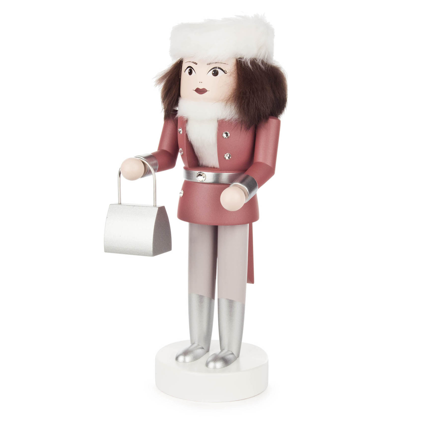 A 25cm pink nutcracker figure styled as a woman, wearing a pink coat with silver buttons, a white fur hat, and holding a metallic handbag.