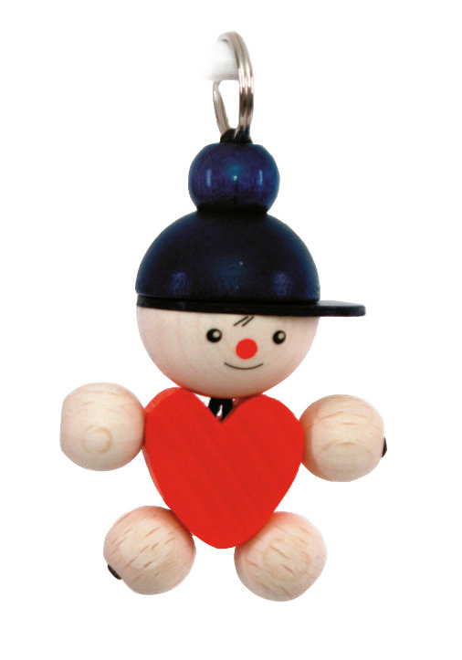 Niedlicher Schlüsselanhänger in Form einer Figur mit blauem Hut und rotem Herz. Die Figur hat einen freundlichen Gesichtsausdruck.