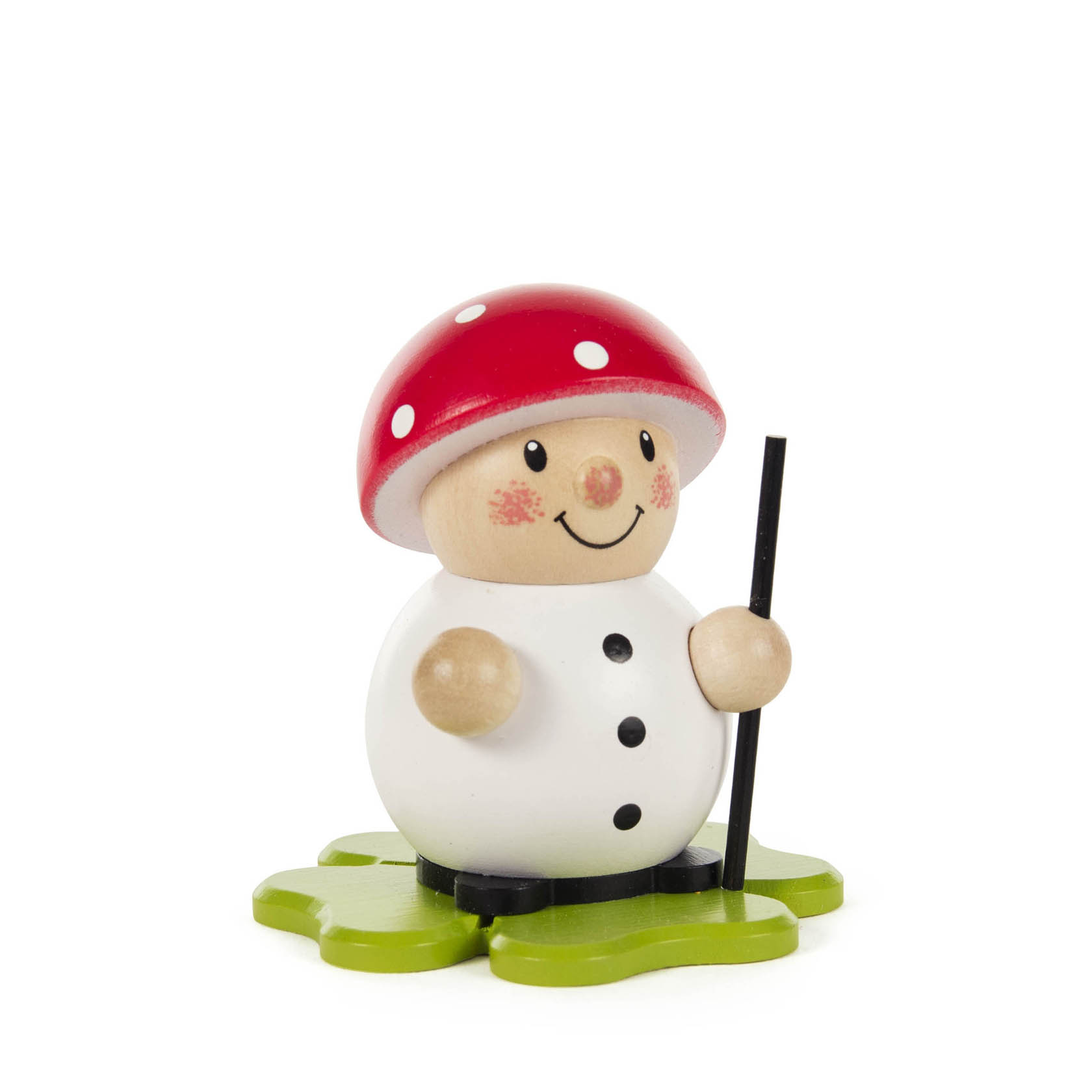 Holzfigur eines lächelnden Pilzes mit roten weißen Punkten als Hut, schwarzen Stock in der Hand, auf einem grünen Kleeblatt stehend. im Dregeno Online Shop günstig kaufen