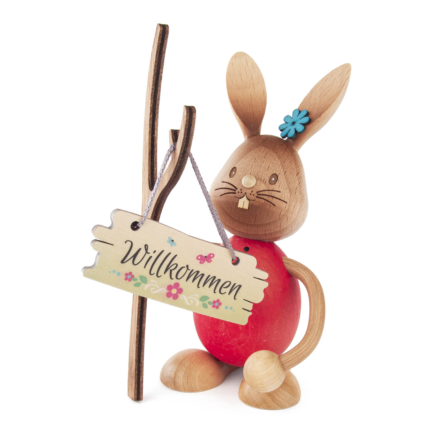 Holzosterhase aufrecht stehend, mit rotem Körper und blauen Blümchen auf dem Kopf, hält ein Willkommensschild. im Dregeno Online Shop günstig kaufen