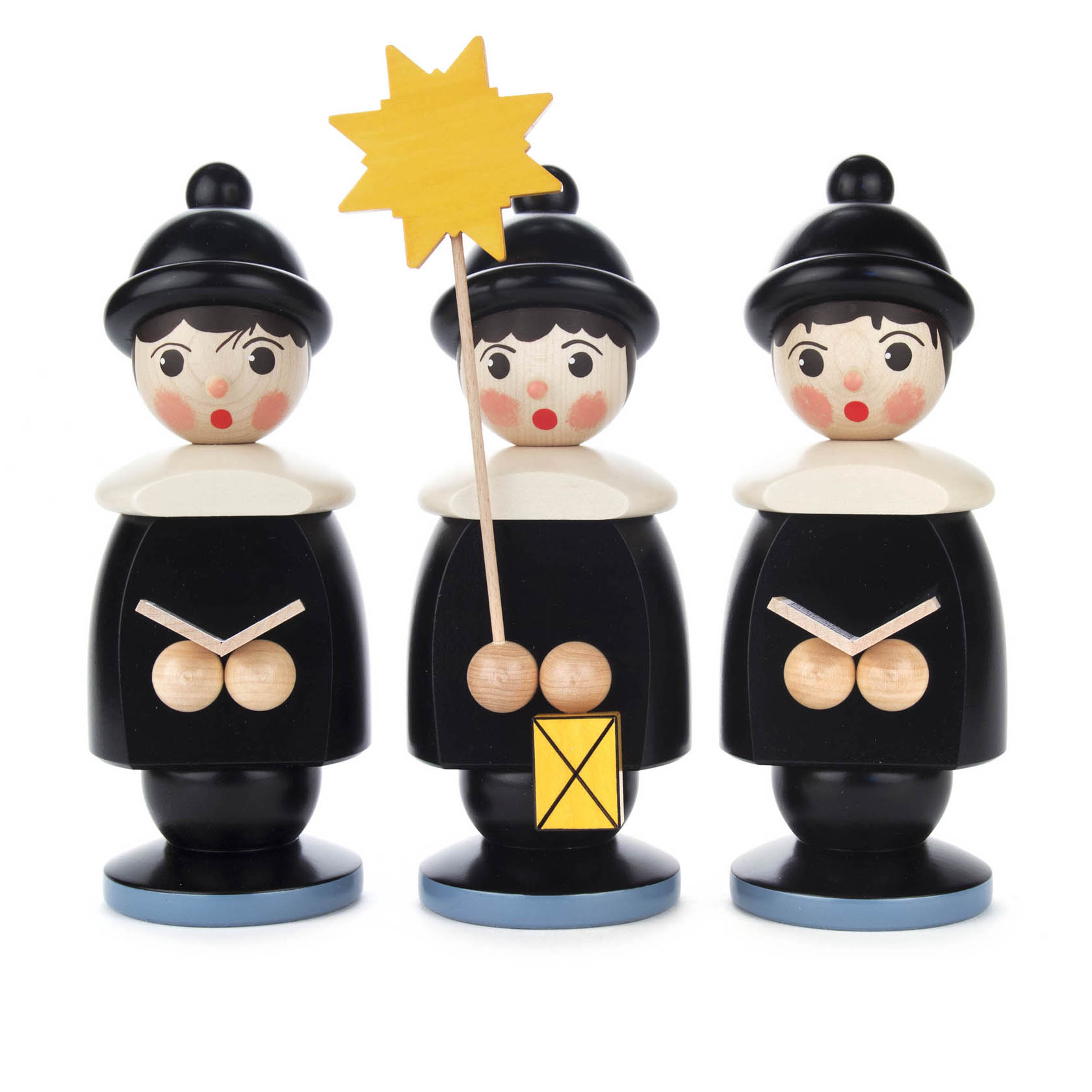 Drei schwarze Kurrendefiguren aus Holz, mit weißem Kragen und Mütze. Die mittlere Figur hält einen gelben Stern und eine Laterne. im Dregeno Online Shop günstig kaufen