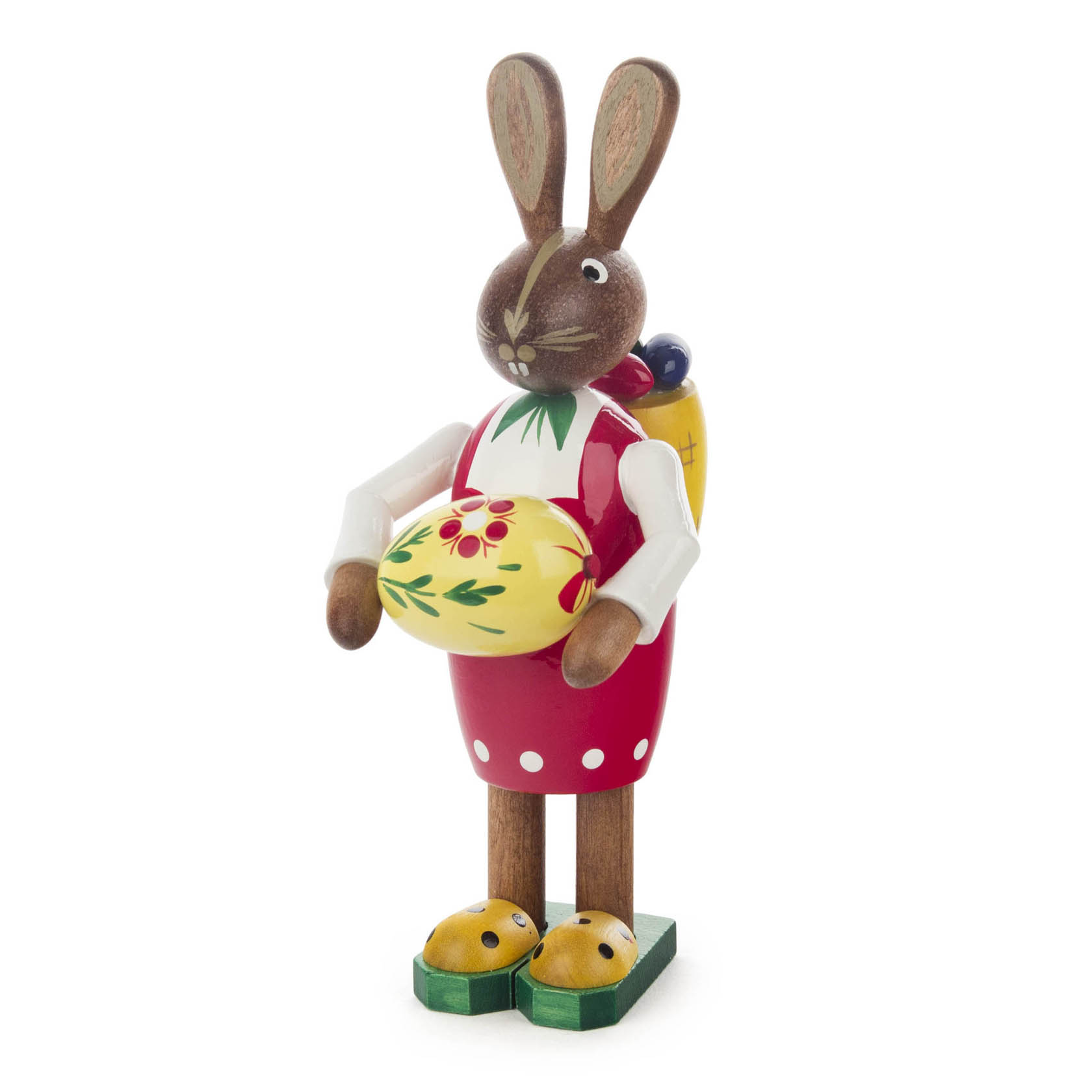 Eine dekorative Osterhasenfigur in Nachbildung einer Frau, 14 cm groß, mit roter Kleidung, hält ein bemaltes Osterei und trägt einen Korb auf dem Rücken. im Dregeno Online Shop günstig kaufen