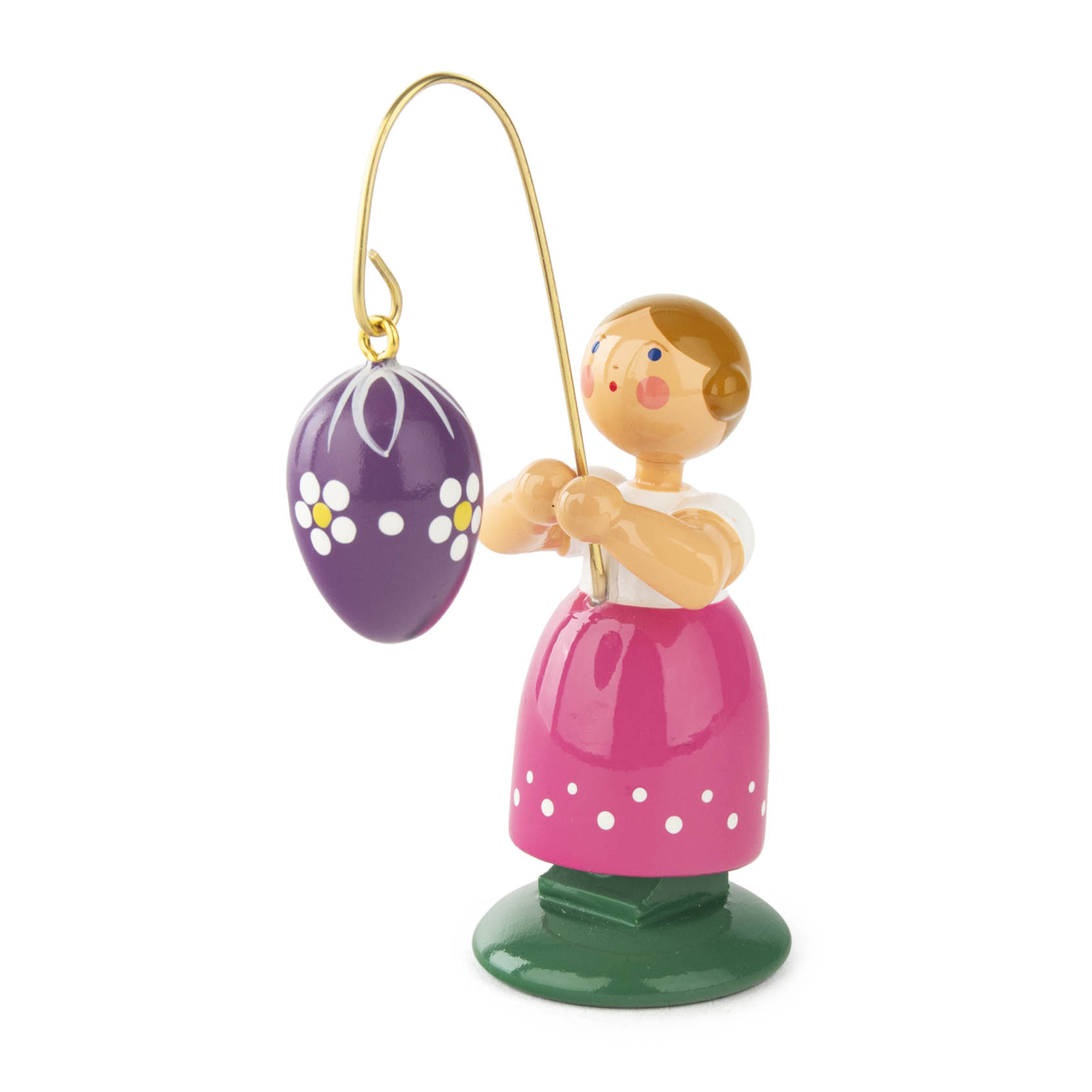 Holzfigur eines Mädchens in rosa Kleid, das ein lila Osterei mit weißen Punkten an einem goldenen Stab hält. im Dregeno Online Shop günstig kaufen