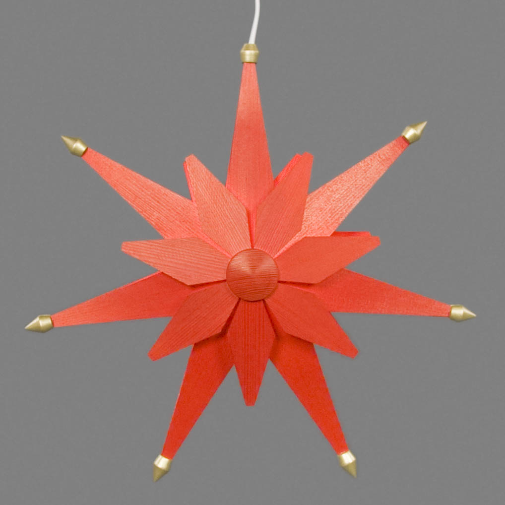 Ein doppelt roter Weihnachtsstern mit goldenen Spitzen und elektrischer Beleuchtung.
