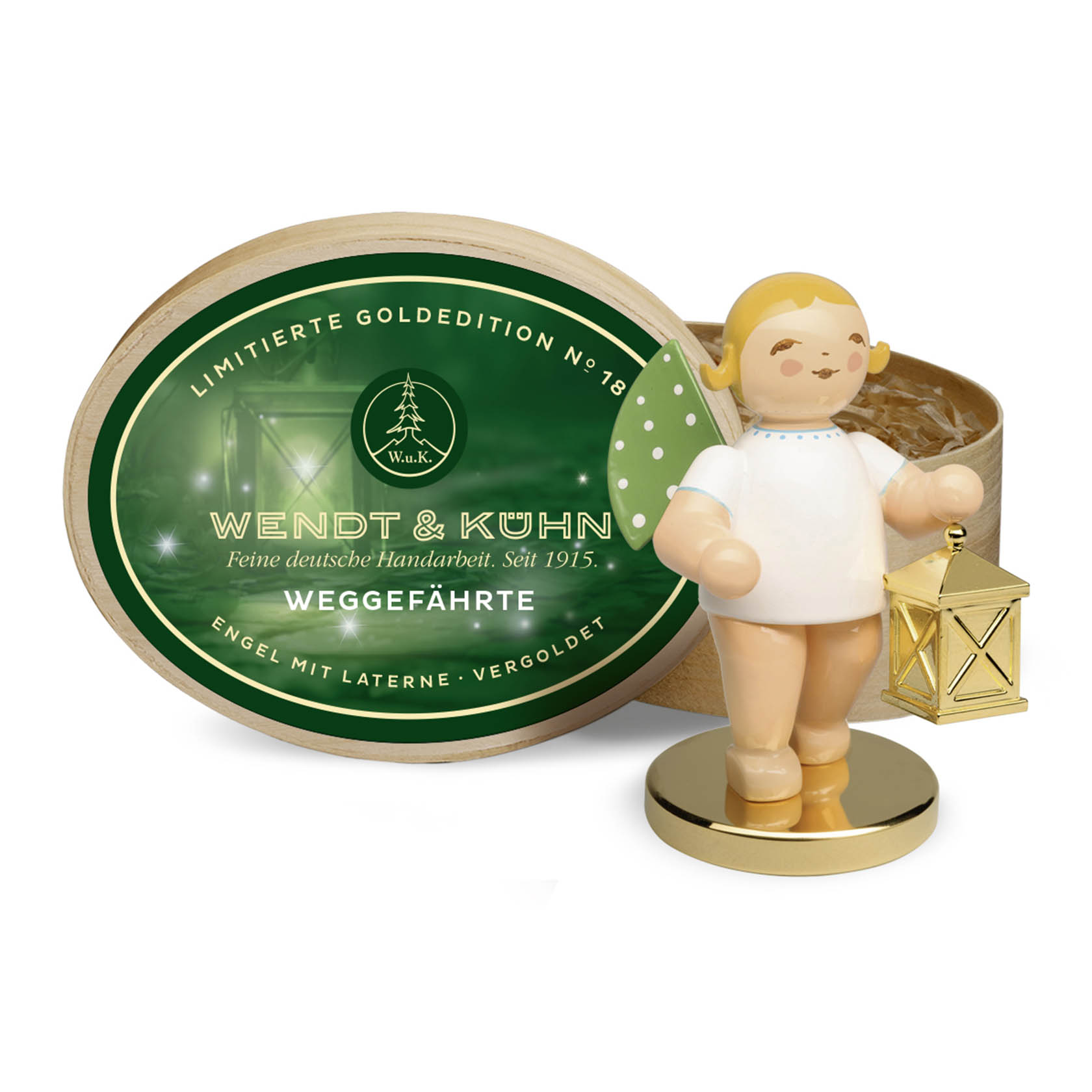Eine Holzfigur eines Engels mit goldener Laterne auf einem runden Metallsockel. Der Engel hat goldene Haare und Flügel. Im Hintergrund steht eine ovale Spanschachtel. im Dregeno Online Shop günstig kaufen